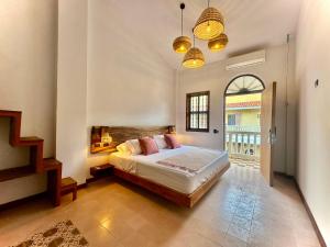 a bedroom with a large bed in a room at Masaya Cartagena in Cartagena de Indias