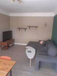 a living room with a bed and a television at 1er etage d'une maison in Sorgues