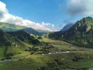 an aerial view of a valley in the mountains at Gagma Chalets Kazbegi in Kazbegi
