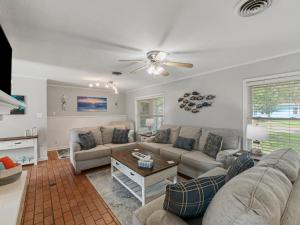 a living room with a couch and a table at The Sea Glass House in Rockport
