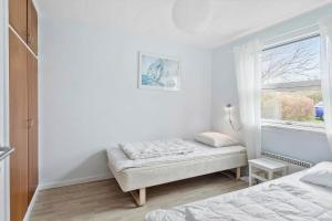 Postel nebo postele na pokoji v ubytování 3036-Stege-Bundgarnet-36