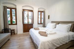 Ένα ή περισσότερα κρεβάτια σε δωμάτιο στο La Casa di Symi