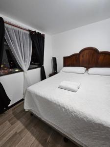 a bedroom with a large bed and a window at Casa Lina in Boca Monte
