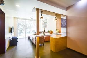 a kitchen with a table and a dining room at ETERNAL WAVE CALANGUTE A Block 204 in Calangute