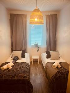 Postel nebo postele na pokoji v ubytování Cozy Apartment