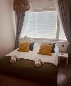 Postel nebo postele na pokoji v ubytování Cozy Apartment