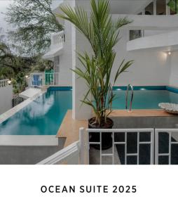 a picture of a house with a swimming pool at Oceansuite hotel Goa in Orxel