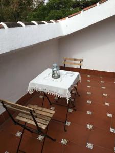a table and two chairs on a patio at El Tio Mateo in Marbella +46 photos