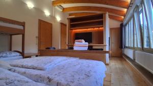 Postel nebo postele na pokoji v ubytování Apartmány U Libuše