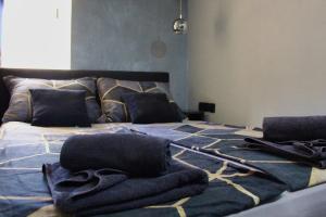 a bed with towels sitting on top of it at Mala Porta in Trogir