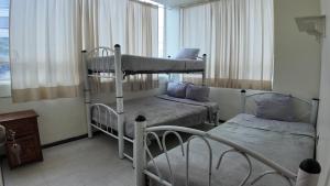 Postel nebo postele na pokoji v ubytování Hostal Ciudad de Mexico