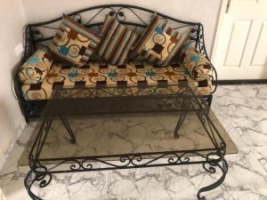 a couch with pillows on a table in a room at Villa zaytoun in Agadir