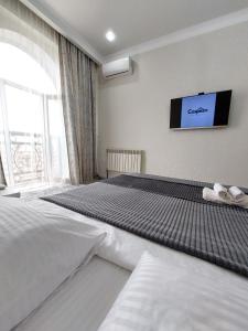 En eller flere senge i et værelse på Top Level House