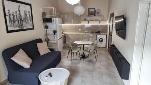 a small living room with a couch and a table at Historical Center Pretty House in Limassol +12 photos