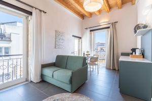 Posezení v ubytování La Dimora di San Nicola Ortigia Boutique Apartments - Terrace & Jacuzzi Access