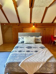 a bedroom with a large bed in a attic at Studio Palma in Zvornik +2 photos