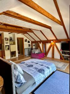 a bedroom with a large bed in a attic at Studio Palma in Zvornik