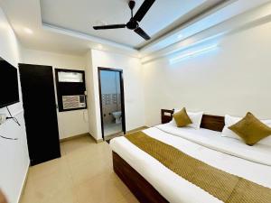 Ένα ή περισσότερα κρεβάτια σε δωμάτιο στο Diamond Home stay - Near Reliance Mart