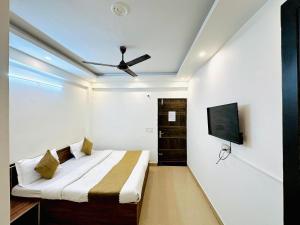 Ένα ή περισσότερα κρεβάτια σε δωμάτιο στο Diamond Home stay - Near Reliance Mart