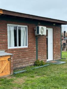 a house with a fan on the side of it at OKIN 1 Cobos in Mar de Cobo +9 photos