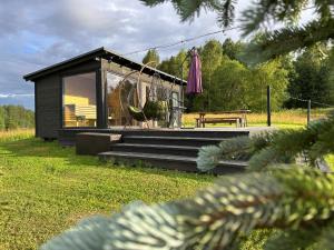 Jardí fora de Melnā kalna kamene, sauna iekļauta cenā