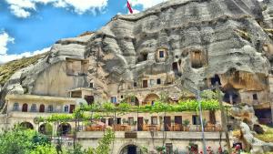 a building built into the side of a mountain at Elite Cave Suites in Göreme
