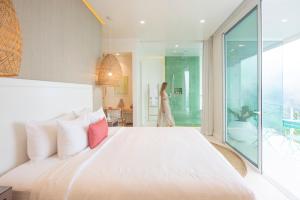 Ένα ή περισσότερα κρεβάτια σε δωμάτιο στο The Retreat Costa Rica - Wellness Resort & Spa