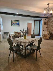 a dining room with a table and chairs and a room at Ca' San Valentino in Pontelongo