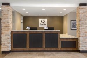 a lobby of a quality clinic with a reception counter at Quality Inn & Suites Kingston in Kingston