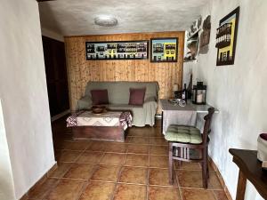 a living room with a couch and a table at El Sueño Del Angel in Santa Cruz de la Palma