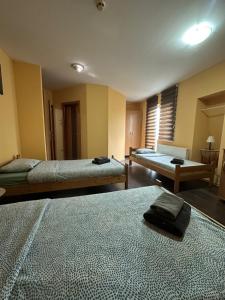 Giường trong phòng chung tại Vila Belilo