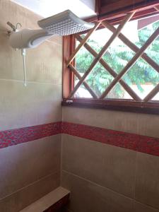 a bathroom with a window and a shower at Uva Blue Villas - Studio apartment 3 - Modern 1 Bedroom, close to beach in Cocles