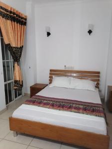 Ένα ή περισσότερα κρεβάτια σε δωμάτιο στο Sun City Apartment