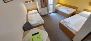Ένα ή περισσότερα κρεβάτια σε δωμάτιο στο Hotel Zámeček