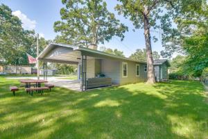 a house with a picnic table in a yard at Walk to Marina and Lake Family Retreat in Afton! in Afton
