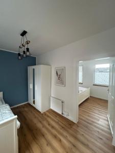 an empty room with a bed and a window at Alte Schmiede Karden in Treis-Karden