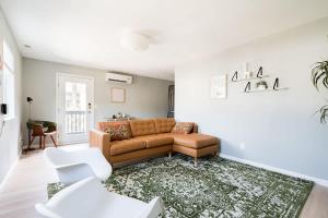 a living room with a couch and a rug at Luxurious Portland 3BR in the Pearl District in Portland