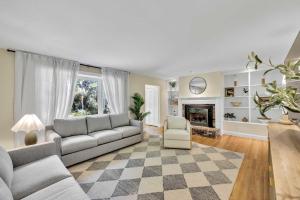 a living room with a couch and a fireplace at Secluded 3-Bedroom Retreat in Falmouth in Falmouth