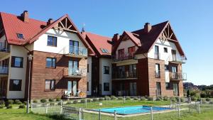 Bazén v ubytování Apartament Lisi Jar Jastrzębia Góra Widok 4 nebo v jeho okolí