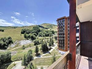 a view from the balcony of a building at Résidence Pegase - APPARTEMENT 3 PIECES 7 PERSONNES PISTES MAE-9854 in Le Corbier