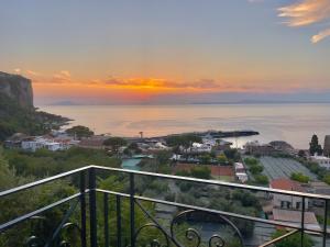 a view of the ocean at sunset from a balcony at Seventy Steps in Vico Equense