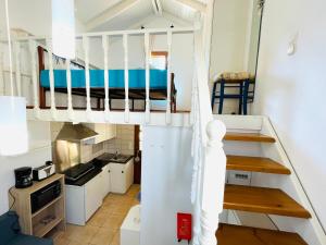 a small room with a bunk bed and a kitchen at Hidden Gem at Kiani Beach in Kalyves