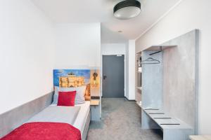 Postel nebo postele na pokoji v ubytování Rimedya Hotel - an der Messe München