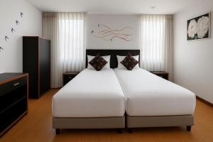 Postel nebo postele na pokoji v ubytování Benidorm Hotel