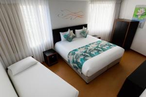 Postel nebo postele na pokoji v ubytování Benidorm Hotel