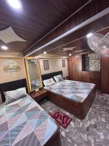 Postel nebo postele na pokoji v ubytování Shree Narayana Guest House