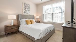 a white bedroom with a bed and a window at Landing at La Tierna - San Antonio Northwest Side in San Antonio +39 photos