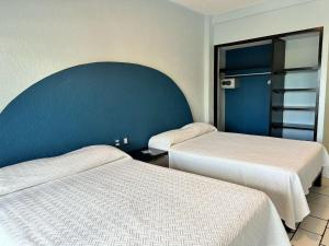 Postel nebo postele na pokoji v ubytování Acamar Beach Resort