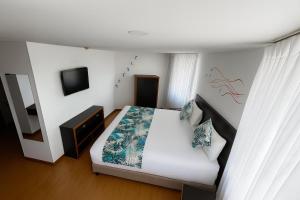 Postel nebo postele na pokoji v ubytování Benidorm Hotel