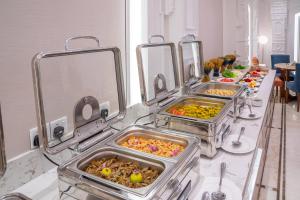 a buffet line with many trays of food at Nars Plus Al Naeem Hotel in Jeddah +23 photos